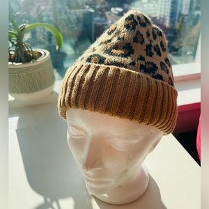 Leopard toque, soft black fluffy material inside, keep your head nice and warm